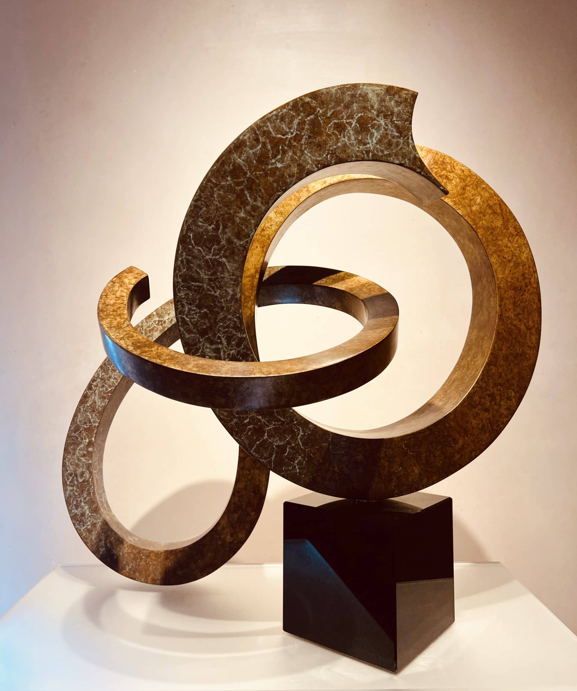 bronze swirl with granite base